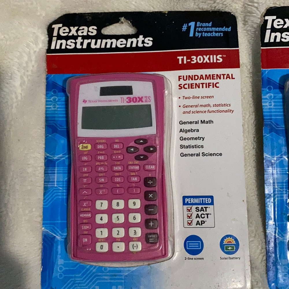 Pink/Black Texas Instrument scientific calculators